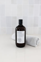 Load image into Gallery viewer, Bottle of dog shampoo with natural ingredients, sulphate and paraben free with spiced cucumber, lavender and tea-tree scent in a bathroom
