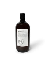 Load image into Gallery viewer, Bottle of dog shampoo with natural ingredients, sulphate and paraben free with spiced cucumber, lavender and tea-tree scent
