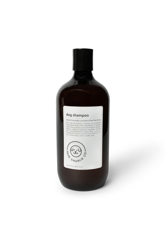 Bottle of dog shampoo with natural ingredients, sulphate and paraben free with spiced cucumber, lavender and tea-tree scent